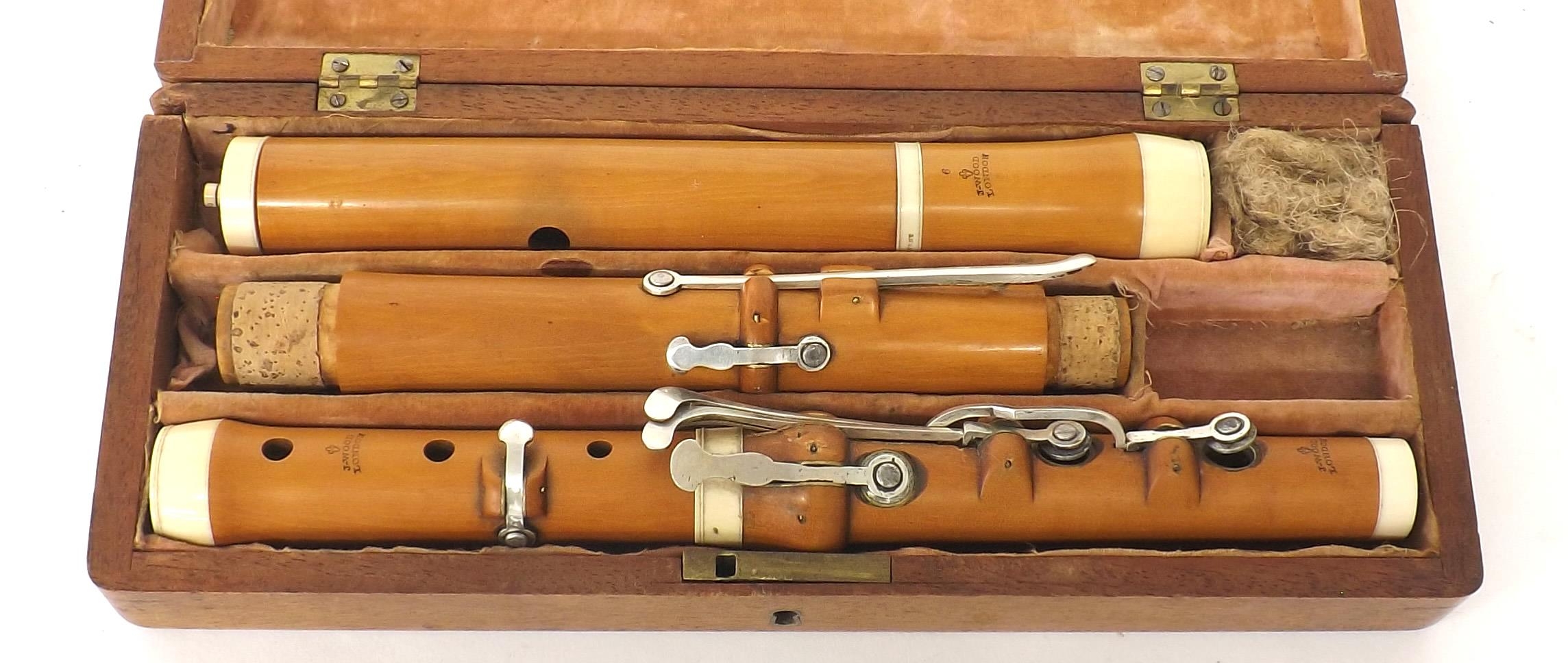 Boxwood and ivory flute by and stamped J. Wood, London, with eight silver keys on wooden blocks, - Image 2 of 2