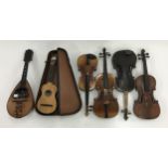 Three old full size violins and a contemporary half size violin; also an old Neapolitan mandolin