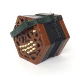 C. Jones concertina in need of restoration, with twenty-seven bone buttons on pierced mahogany ends,