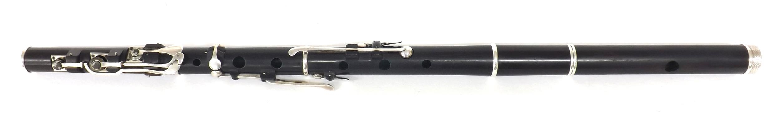 Good cocuswood flute by and stamped Rudall & Rose, London, with patent head joint and eight silver