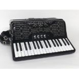 Moreschi piano accordion with seventy-two buttons and five switches, black finish, soft case