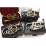 Four various vintage cased cornets, including Millereau á Paris, Philpot of Luton and two Boosey &