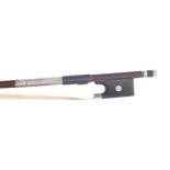 German silver mounted violin bow, faintly stamped, the stick round, the ebony frog inlaid with pearl