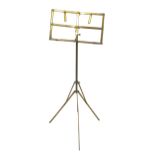 Late Victorian brass adjustable tripod music stand, with openwork ledge