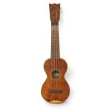Old Hawaiian ukulele labelled Bergstrom Music Co. Ltd, Hawaiian songs and instruments,