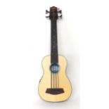 Kala bass ukulele labelled U.Bass, model no: U.Bass-SSMHG-FL no.1044035088, with banded back and