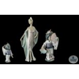Lladro Hand Painted Pair of Porcelain Fi