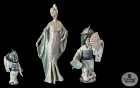 Lladro Hand Painted Pair of Porcelain Fi