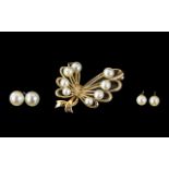 9ct Gold Stylized Ribbon Brooch. Set Wit