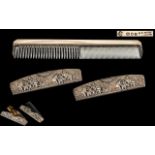 An Asprey Silver Backed Comb, fully hallmarked for London T 1954. Length 7''. Together with two