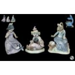 Collection of Three Nao figures, comprising a young girl with a dog, 7" tall,