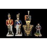 Military Interest: Pair of Decorated Porcelain Soldier Figures, highlighted in gilt,