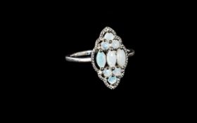 Australian Coober Pedy Opal Ring, size S; three marquise cut opals, set across the finger,