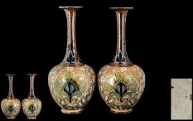 Pair of 19th Century Doulton Lambeth Bottle Form Vases, one neck restored, impressed marks to base.