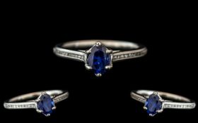 Platinum - Contemporary Sapphire and Diamond Set Dress Ring. The Faceted Cornflower Blue Sapphire of
