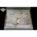 A Modern Lalique Frosted Glass Pendant Drop, on a gold plated chain, in a fitted box.