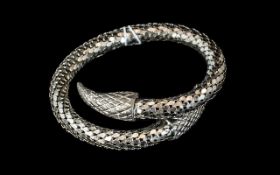 A White Metal Snake Bracelet, bracelet formed as scales. Marked Whiting and Davis Company.
