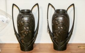 A Pair of French Art Nouveau Style Twin Handled Vases raised floral decoration to both front and