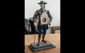 Vintage JVE Dutch Cast Iron Figure Clock Seller 'Man of the Time' Measures 15" tall.