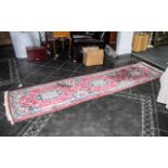 A Woollen Hall Runner, predominately reds, with geometric design. 32" wide x approx. 120" long.