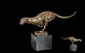 A Contemporary Bronze Cased Sculpture of a Running Leopard In Full Flow,