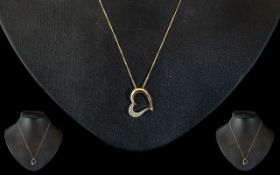 9ct & Diamond Heart Shaped Pendant on a 9ct Gold Chain.