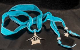 Balar Statement Silver Necklace, Suspended on a Vibrant Sky Blue Ribbon,