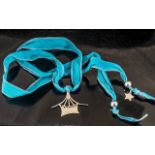 Balar Statement Silver Necklace, Suspended on a Vibrant Sky Blue Ribbon,