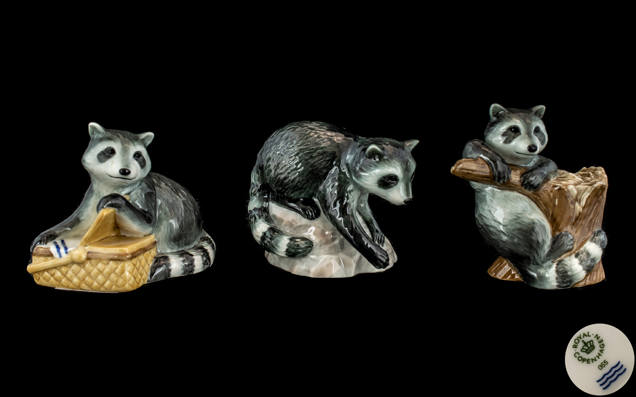 Royal Copenhagen Trio of Hand Painted Porcelain Figures. Comprises 1/ Raccoon - Climbing on a