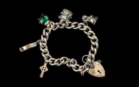 Vintage - Silver Charm Bracelet Loaded with Five Silver Charms and Heart Shaped Padlock.