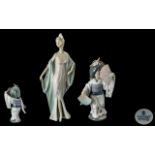 Lladro Hand Painted Pair of Porcelain Figures. Comprises 1/ Sophisticate, Model 5787. Issued