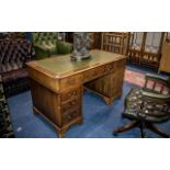 A Leather Topped Twin Pedestal Desk of typical form, three frieze drawers,