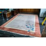 Large Room Size Rug, hand crafted in China. 8' x 11'. Pale colours with floral decoration.