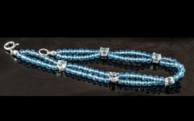 Sky Blue Topaz Station Bracelet, five round cut, sky blue topaz gems, claw set in silver mounts,