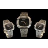 A Roy King Silver Wrist Watch, rectangular shaped case with black dial,