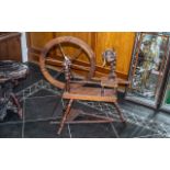 A Wooden Framed Traditional Made Spinning Wheel height 34 inches, 32 inches length.