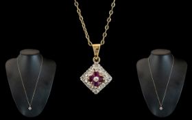 Ladies Attractive 9ct Gold Diamond and Ruby Set Pendant - Attached to a Long 9ct Gold Chain.