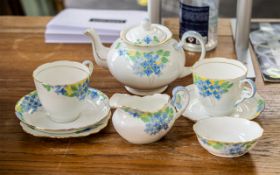 Grafton Handpainted Tea Service, comprising a tea pot, milk jug, sugar bowl, two tea cups and two