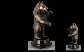 An Early 20th Century Carved Bavarian Bear (Black Forest) with musical mechanism. Height 12 inches.