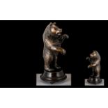 An Early 20th Century Carved Bavarian Bear (Black Forest) with musical mechanism. Height 12 inches.