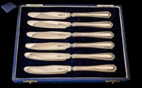 A Boxed Set of Six Sterling Silver Butter Knives. Both Blade and Handle Hallmarked for Silver.