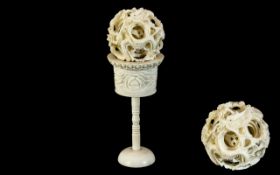 Early 20th Century Carved Ivory Puzzle Ball and Stand. Height 5.5 Inches - 13.75 cms.
