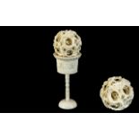 Early 20th Century Carved Ivory Puzzle Ball and Stand. Height 5.5 Inches - 13.75 cms.