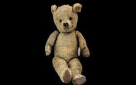 Early 20th Century Jointed Teddy Bear. Early Straw Filled Teddy Bear, Padded Paws, Glass Eyes.
