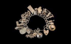 An Excellent Quality Vintage Sterling Silver Charm Bracelet - Loaded with 20 Charms.