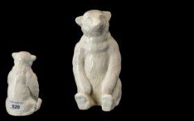 Antique Porcelain Bear In Sitting Form.
