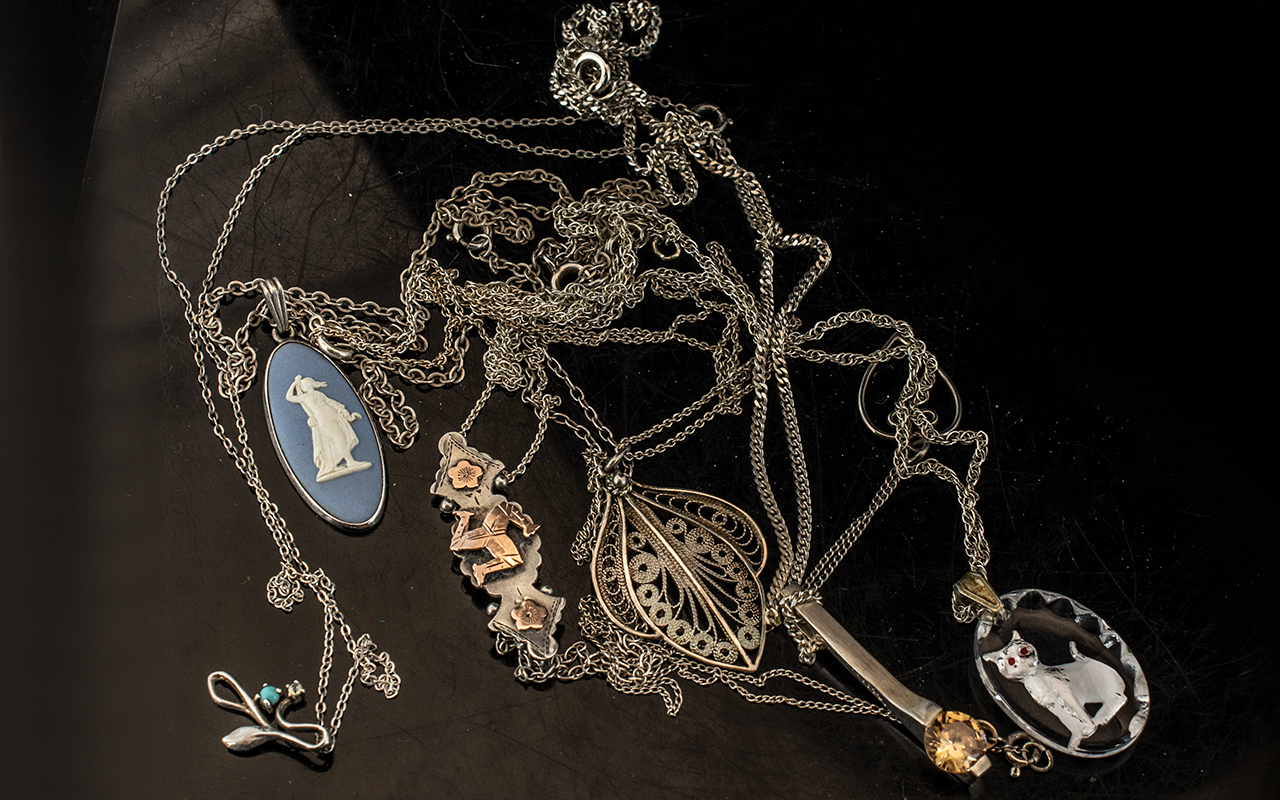 Collection of Seven Silver Chains & Pendants. Various designs, some unmarked.