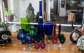 Collection of Coloured Glassware, comprising a 19" blue glass vase, an 11" green glass vase,