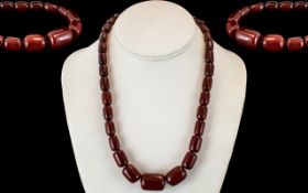 Early 20th Century Cherry Amber Graduated Beaded Necklace with Gold Coloured Clasp.