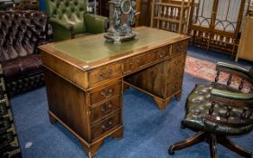 A Leather Topped Twin Pedestal Desk of typical form, three frieze drawers,